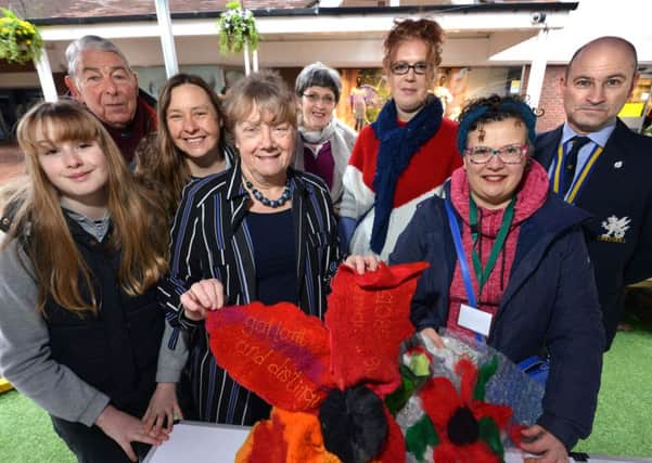 Sylvia Harris (centre) with textile designer Jenni Burrows and volunteers at the workshop. Picture: Peter Cripps