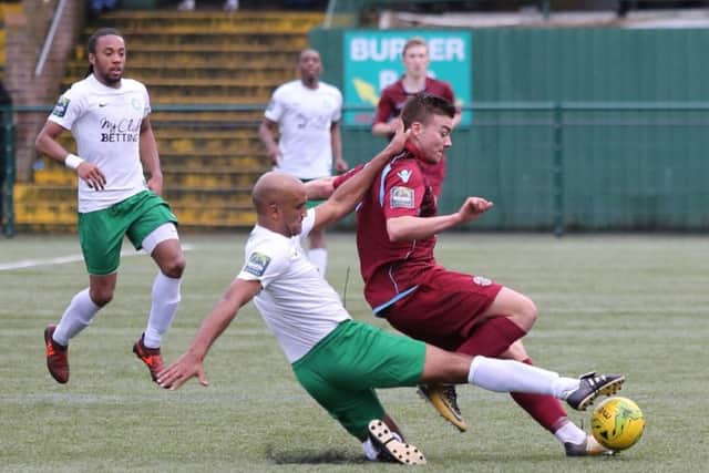 Davide Rodari is challenged by a Whyteleafe opponent. Picture courtesy Scott White