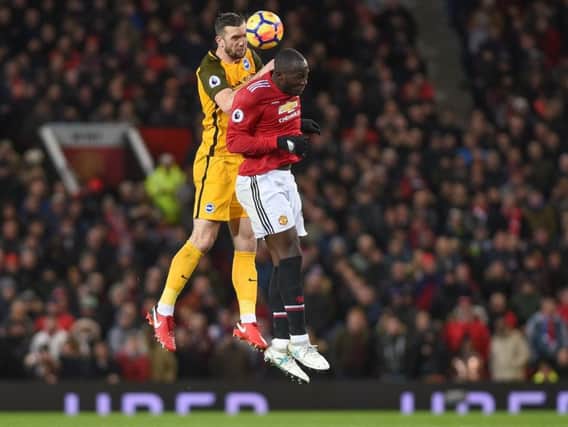 Shane Duffy wins an aerial battle with Romelu Lukaku during Albions 1-0 Premier League defeat at Manchester United. Picture by Phil Westlake (PW Sporting Photography)