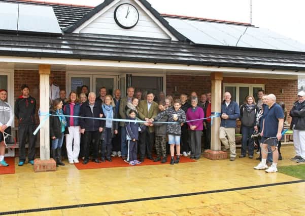 DM1831730a.jpg. Opening of new Clubhouse and courts at Slinfold Tennis Club. Horsham MP Jeremy Quin cuts the ribbon helped by, L to R Leah Spencer, 9, Francesca Sperring 13, Ben Cowland 14 and brother Lucas Cowland, 11. Photo by Derek Martin Photography. SUS-181003-181641008