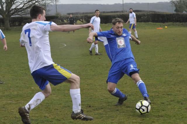 Sidley United and Northiam 75 battle it out at Hooe Recreation Ground.