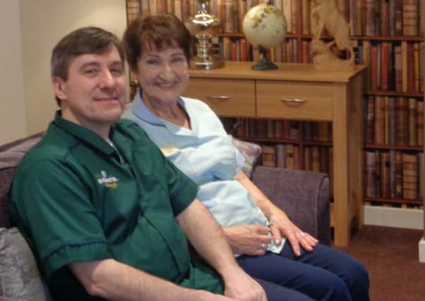 Dorothy Clark with Peter Crabb who both work at Westlake House care home in Horsham SUS-180320-104122001