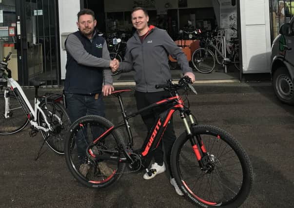 Soldier Jamie Wright (right) with ebike Centre owner Steve at the Birdham Road shop