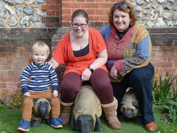 Katie Bramley, a member of the trail's project team, her son Jethro and the Rev Sara-Jane Stevens, right, with the sheep. Picture: Phil Westlake pww_6637