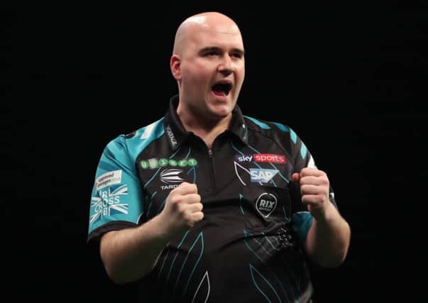 Rob Cross celebrates during his victory over Michael Smith in Leeds last week. Picture courtesy Lawrence Lustig/PDC