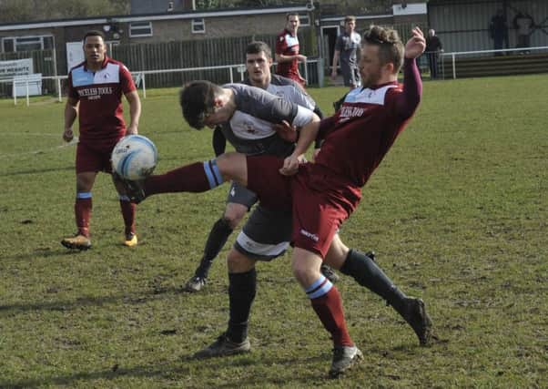 Little Common forward Jamie Crone gets his foot to the ball against Wick last weekend. Pictures by Simon Newstead