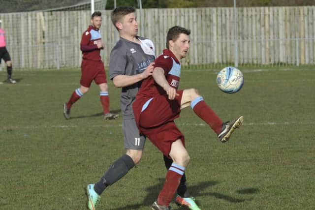 Adam Smith brings the ball under control during the promotion-clinching 2-0 victory at home to Wick.