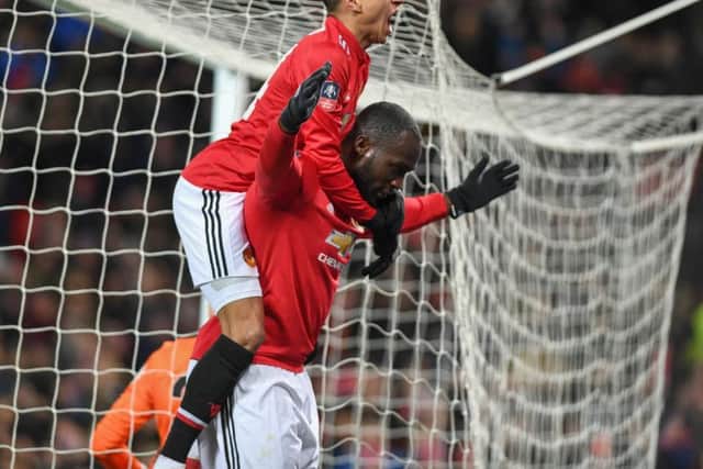 Jesse Lingard and Romelu Lukaka celebrate United's opening goal. Picture by Phil Westlake (PW Sporting Photography)