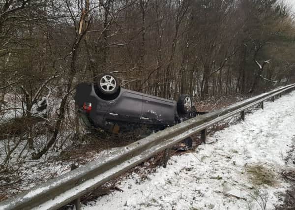 The car overturned on the A264, according to officers. Picture: Sussex Police