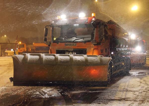 A Highways England gritter dealing with the snow