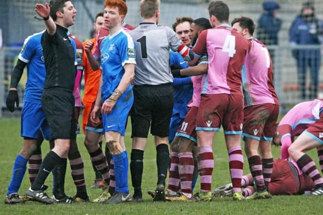 Both sets of players come together following a heavy Tadley Bromage tackle, which saw him shown a straight red card. Picture Derek Martin