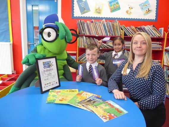 Katie Conner from 3D Recruit Education, with Buster Bug and pupils Luca Mason and Katie Bollington