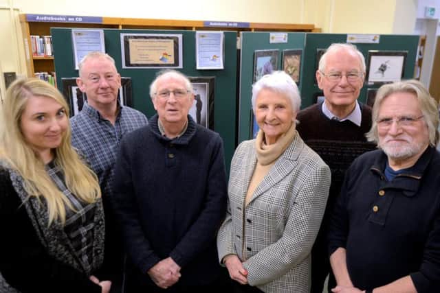 Hannah Chidwick, senior library assistant, left, with members of Littlehampton U3A Advanced Photography Group, from left, FrankTogher, David Cashford,  Marion  Williams, Peter Spencer and Simon Axford-Jones.Picture: Kate Shemilt ks180116-1