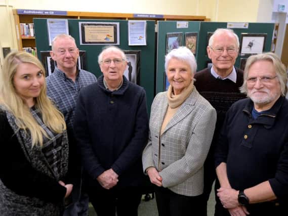 Hannah Chidwick, senior library assistant, left, with members of Littlehampton U3A Advanced Photography Group, from left, FrankTogher, David Cashford,  Marion  Williams, Peter Spencer and Simon Axford-Jones.Picture: Kate Shemilt ks180116-1