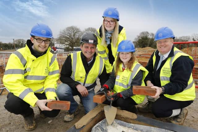 Abigail Skippings places the first brick on site at David Wilson Homes Rosewood Park development,  Bexhill SUS-180320-153658001