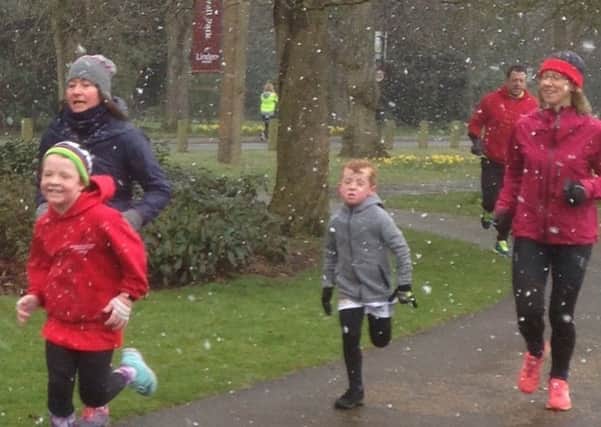 Fun runners battle through the snow at Graylingwell Park