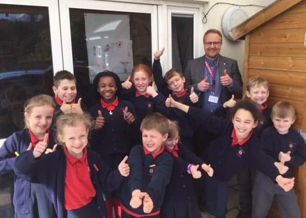 Cllr James Bacon and pupils at Sacred Heart Catholic Primary School SUS-180321-142848001