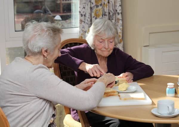 Residents tuck in to their food