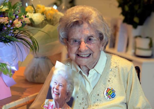Rene Neil with a birthday bouquet and a card from the Queen. Picture: Kate Shemilt ks180128-1