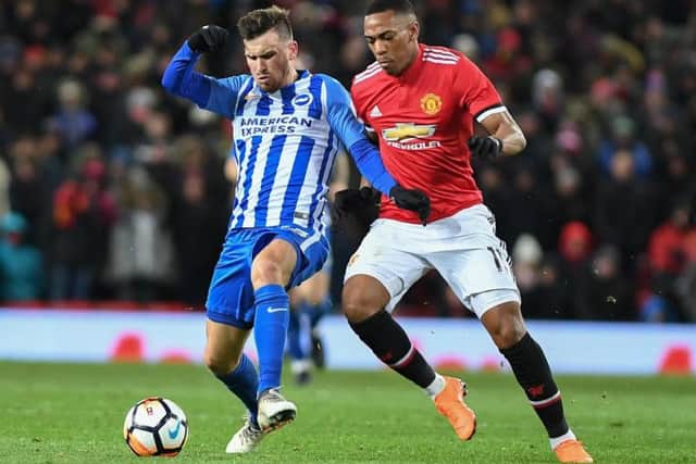 Pascal Gross and Anthony Martial battle for possession. Picture by Phil Westlake (PW Sporting Photography)