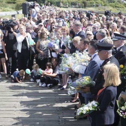 Hundreds of people gathered to pay their respects to the Shoreham Airshow victims, one year on
