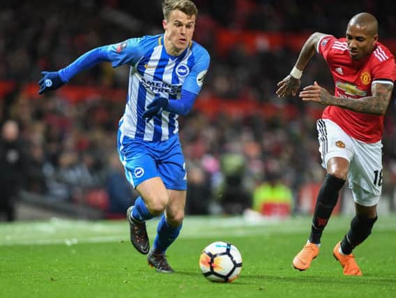 Solly March takes on Manchester United full-back Ashley Young. Picture by Phil Westlake (PW Sporting Photography)
