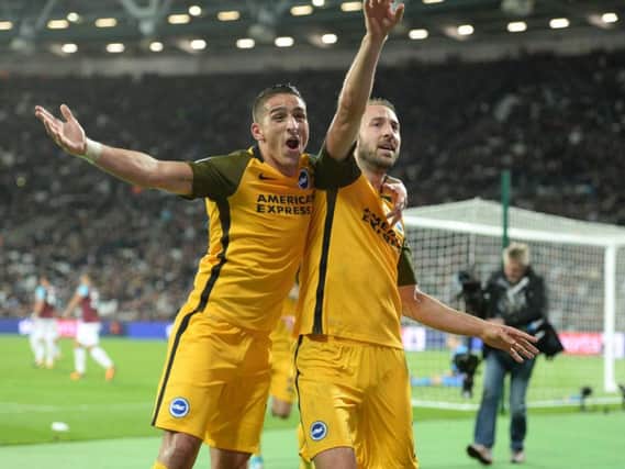 Glenn Murray (right) celebrates with Anthony Knockaert after scoring the third goal in Albion's 3-0 win at West Ham. Picture by Phil Westlake (PW Sporting Photography)