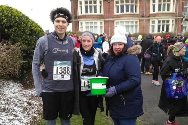 William Peters and Claire ONeill with EFTs Teresa Paterson at the Hastings Half  Marathon 2018 SUS-180328-132834001