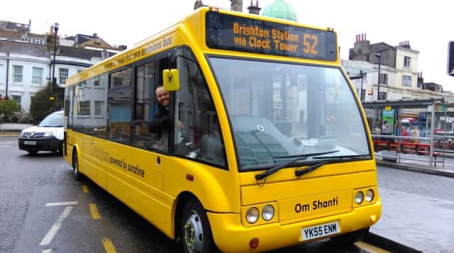 Tom Druitt behind the wheel of one of The Big Lemon's electric buses