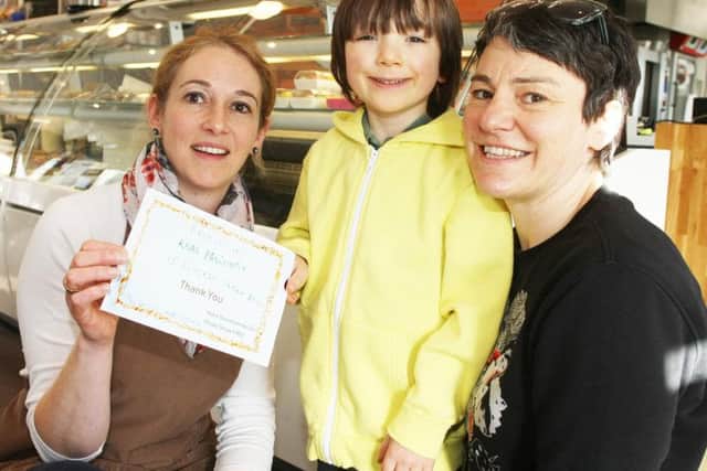 Gabriel presents a certificate to Helene Berthillot from of Real Patisserie in Shoreham
