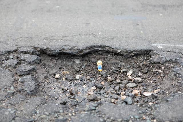 Pothole in Poulters Lane, Worthing SUS-180320-132105001