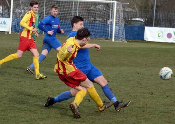 Cameron Corell in the thick of the action for Selsey against Lingfield / Picture by Kate Shemilt
