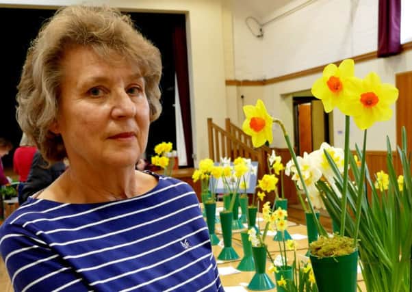 Barbara Blake with her vase of narcissi, which won the Jack Hesling Trophy in a class for novice exhibitors