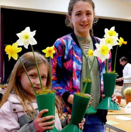 Abi Pendleton and Isabelle Layt with their prize-winning narcissi in the young persons classes