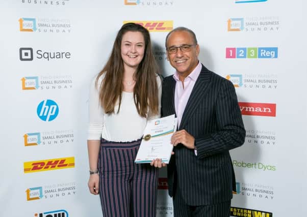 Hollie-Ella is presented with her business award by Theo Paphitis 9JoBOCnEoo0V3zKJ3pEG