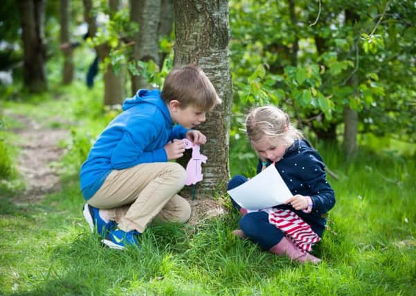 Finlay, ten, and Eleanor, seven, looking for Easter bunnies hidden around Brookfield Park during last year's Littlehampton Town Council Easter event