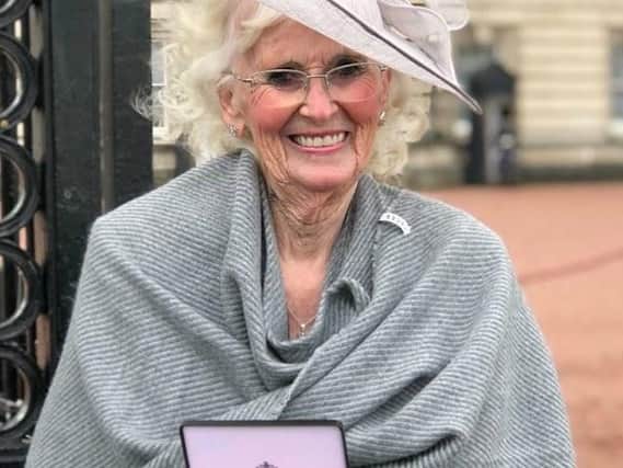 Barbara 'Babs' Bower pictured with her MBE