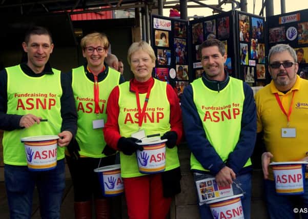 Trustees of the Adur Special Needs Project made a bucket collection at Worthing Football Club's match on Saturday, raising more than Â£300.