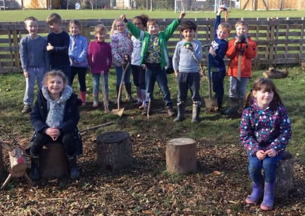 Children at Goring Primary School have been helping plant trees to improve their Forest School site