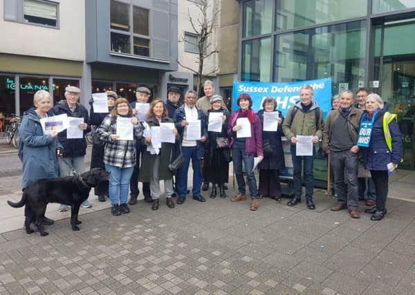 Campaigners outside Jubilee Library this afternoon, before handing a petition to Brighton and Hove CCG
