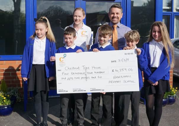 Staff and pupils with the cheque