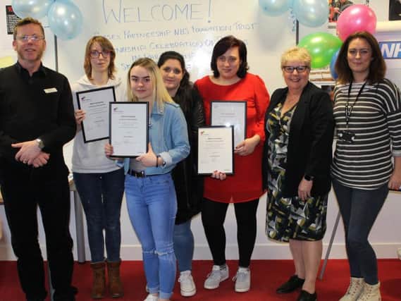 (L to R) Mark Melling, Head Nurse at Mill View Hospital, Skills Training UKs traineeship learners Anna Murray, Chloe O'Brien, Louise Daniels, and Alisha Lynch, Sussex Partnership NHS Foundation Trusts Alison Bradbury and El Dyson from the Youth Employability Service at Brighton & Hove City Council.