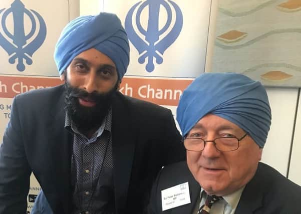 Sir Peter wearing a turban on the Sikh TV channel