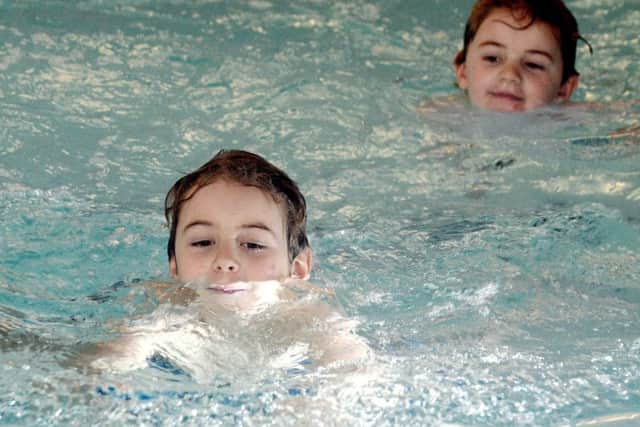 ks180135-6 Gym of Year phot kate
Thomas Dempsey, eight, and his brother Oscar, six in the pool.ks180135-6 SUS-180327-210526008