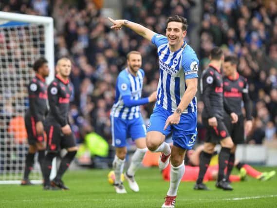 Lewis Dunk celebrates scoring in Albion's 2-1 win against Arsenal. Picture by Phil Westlake (PW Sporting Photography)