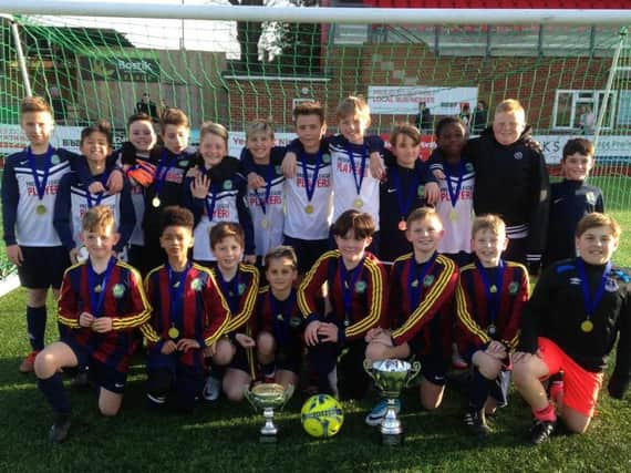 Orchard Junior School year five and six students celebrate their double cup triumph