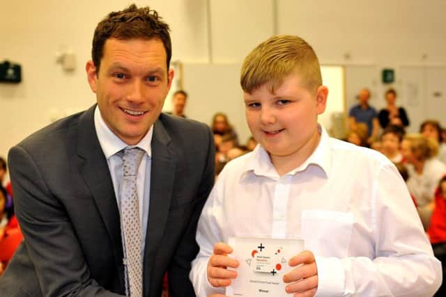 Mikey Webb won Special School Student of the Year at the West Sussex Education Awards. He is pictured with Adam Rowland, head of Woodlands Meed