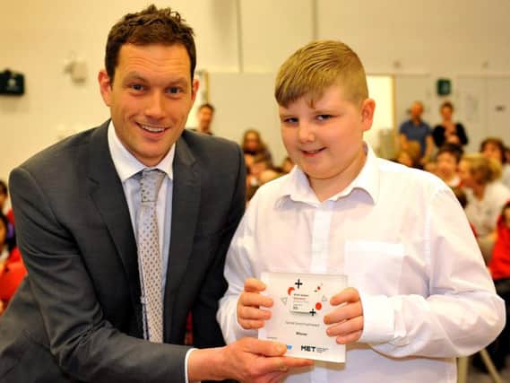 Mikey Webb won Special School Student of the Year at the West Sussex Education Awards. He is pictured with Adam Rowland, head of Woodlands Meed