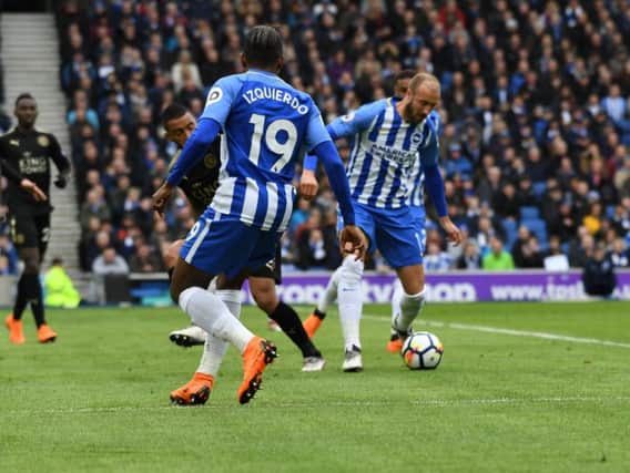 Glenn Murray tries to play his way through the Leicester City defence. Picture by PW Sporting Photography