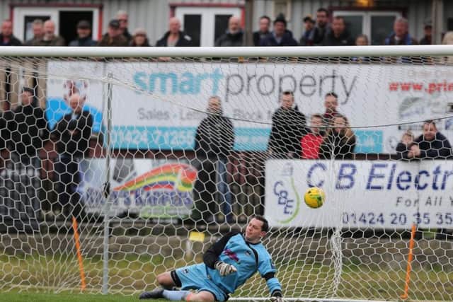 Phoenix Sports goalkeeper Steve Phillips is beaten by a Sam Adams penalty for Hastings United's equalising goal. Picture courtesy Scott White